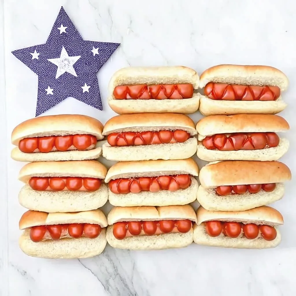 Rows of hot dogs arranged to resemble the stripes of a flag, accompanied by a large blue star in the upper left corner.