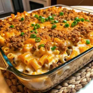 Freshly baked cheeseburger macaroni casserole topped with toasted breadcrumbs and sliced green onions in a glass pan.