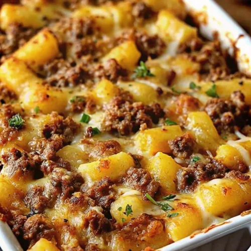 Cheesy minced beef and potato chunk casserole baked to a golden brown with melted mozzarella and fresh herbs.