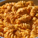 Delicious Buffalo Chicken Pasta served with a creamy sauce and topped with green onions