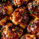 Delicious Garlic Honey Chicken Thighs on a plate garnished with herbs
