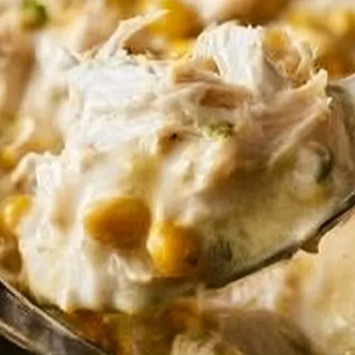 Delicious bowl of homemade white chicken chili topped with cilantro and cheese