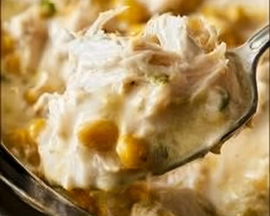 Delicious bowl of homemade white chicken chili topped with cilantro and cheese