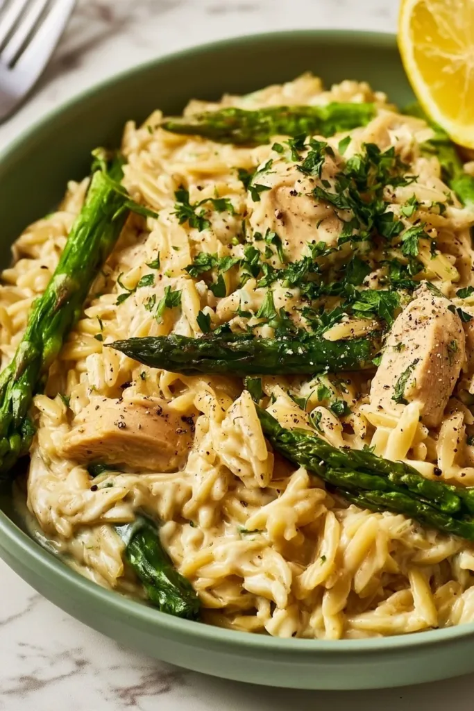 Delicious Chicken Orzo with Asparagus dish served in a bowl.
