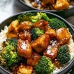 Delicious Hot Honey Chicken Bowl garnished with fresh vegetables and honey drizzle.