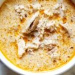 Bowl of low carb high protein chili recipe with fresh herbs and spices