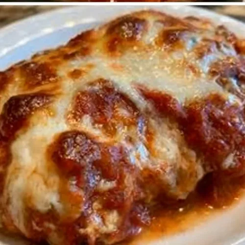 Parmesan Chicken Light Recipe 3 Light Parmesan Chicken dish garnished with herbs on a plate