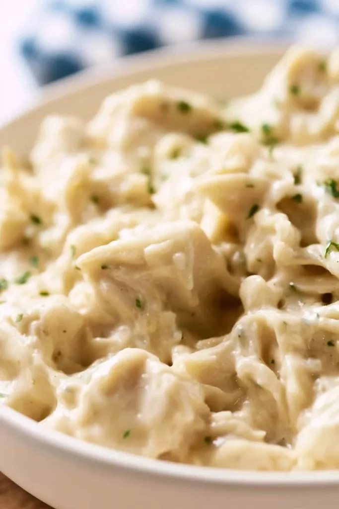 Slow Cooker Creamy Ranch Chicken served with vegetables on a plate