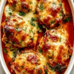 Delicious Tuscan chicken casserole topped with herbs and cheese